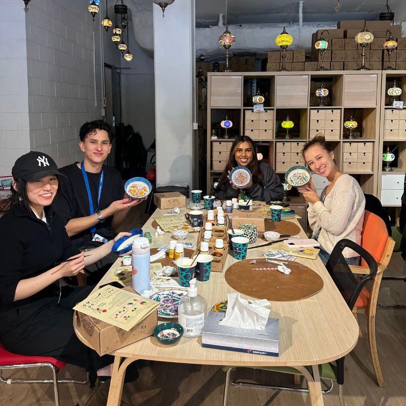 Friends celebrating finished workshop creations together